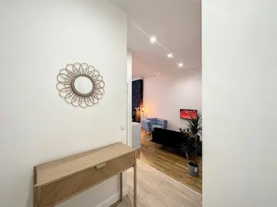 Télévision ou salle de divertissement dans l'établissement Cosy appart Lyon Part Dieu Félix 2