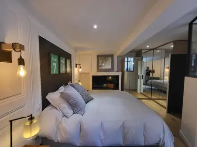 Un ou plusieurs lits dans un hébergement de l'établissement Superbe 100 M2, 4 chambres