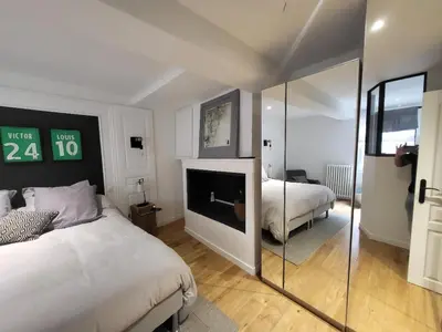 Un ou plusieurs lits dans un hébergement de l'établissement Superbe 100 M2, 4 chambres