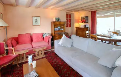 Coin salon dans l'établissement Cozy Home In Monseveroux