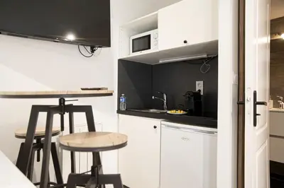 Cuisine ou kitchenette dans l'établissement LES BULLES DE MONA - Le Wilson - Spa