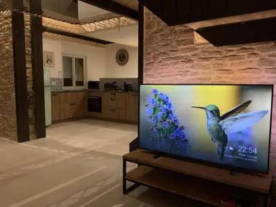Télévision ou salle de divertissement dans l'établissement Gîte de Saint Marcel