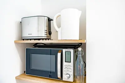 Cuisine ou kitchenette dans l'établissement Le Californie - Agréable studio - wifi inclus