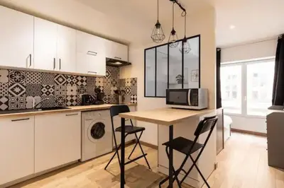 Cuisine ou kitchenette dans l'établissement Le Flesselles - Hyper centre - Calme et cosy