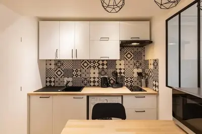 Cuisine ou kitchenette dans l'établissement Le Flesselles - Hyper centre - Calme et cosy