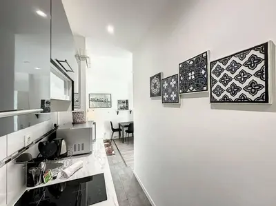 Cuisine ou kitchenette dans l'établissement Cosy appart Perrin 1