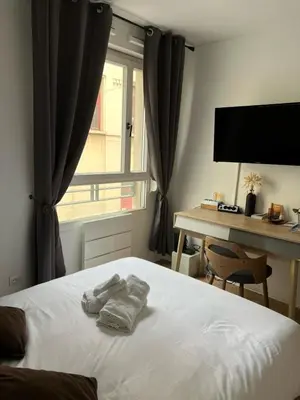 Un ou plusieurs lits dans un hébergement de l'établissement Studio Le Central 350 m de Gare Lyon Part-Dieu, Navette Stade et Arena ,Eurexpo Aéroport- Bus Direct Centre Ville