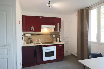 Cuisine ou kitchenette dans l'établissement Appartement Les Trois Renards-Tassin