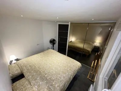 Un ou plusieurs lits dans un hébergement de l'établissement Unique! jacuzzi privé 35°C + cinéma Villa entière