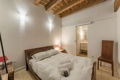 Un ou plusieurs lits dans un hébergement de l'établissement AllinLyon | Appartement familial au Vieux Lyon