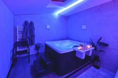 Un ou plusieurs lits dans un hébergement de l'établissement Le Lux Spa