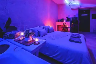 Un ou plusieurs lits dans un hébergement de l'établissement Le Lux Spa