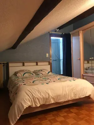 Un ou plusieurs lits dans un hébergement de l'établissement Maison au pied du Beaujolais