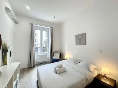 Un ou plusieurs lits dans un hébergement de l'établissement Cosy appart - lyon 6 - Gare Partdieu - Lafayette 1