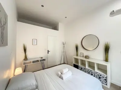 Un ou plusieurs lits dans un hébergement de l'établissement Cosy appart - lyon 6 - Gare Partdieu - Lafayette 1