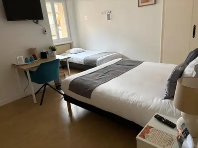 Un ou plusieurs lits dans un hébergement de l'établissement Hôtel Comme chez soi
