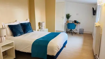 Un ou plusieurs lits dans un hébergement de l'établissement Hôtel Comme chez soi