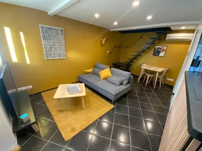 Coin salon dans l'établissement Petite maison de village