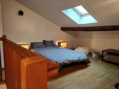 Un ou plusieurs lits dans un hébergement de l'établissement L'Atelier Cosy - Maison de village Atypique
