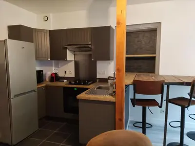 Cuisine ou kitchenette dans l'établissement L'Atelier Cosy - Maison de village Atypique
