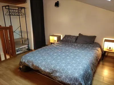 Un ou plusieurs lits dans un hébergement de l'établissement L'Atelier Cosy - Maison de village Atypique