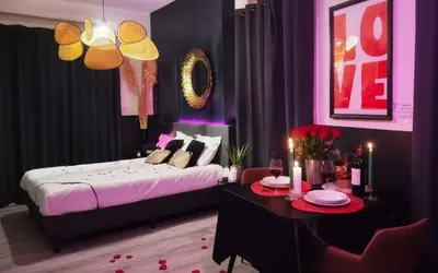 Un ou plusieurs lits dans un hébergement de l'établissement Suite Passion - Jacuzzi privé - Table massage