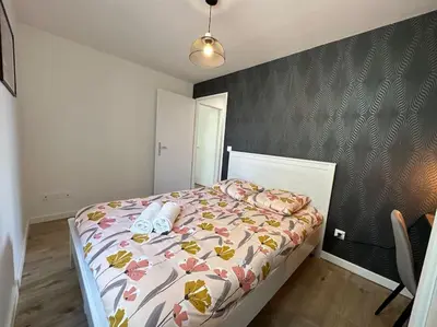 Un ou plusieurs lits dans un hébergement de l'établissement Appartement JAZZ Vienne nord