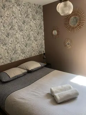 Un ou plusieurs lits dans un hébergement de l'établissement Appartement Vignes 2 personnes