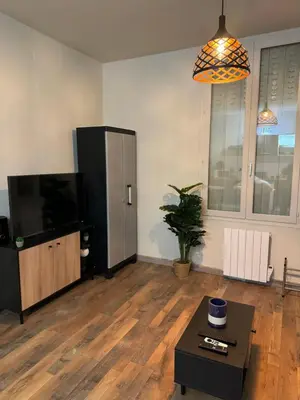 Télévision ou salle de divertissement dans l'établissement Le Zéphyr