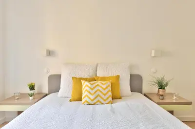 Un ou plusieurs lits dans un hébergement de l'établissement Appartements centre ville Villefranche-Sur-Saone