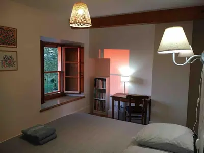 Un ou plusieurs lits dans un hébergement de l'établissement Maison confortable et calme, 2 chambres