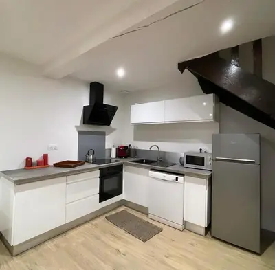 Cuisine ou kitchenette dans l'établissement Maison au coeur de la Dombes