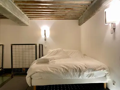 Un ou plusieurs lits dans un hébergement de l'établissement Loft moderne & cosy Terreaux / Croix Rousse - Courts et longs séjours