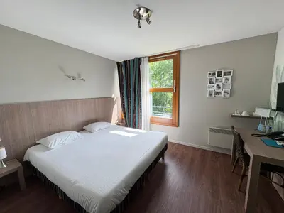 Un ou plusieurs lits dans un hébergement de l'établissement L'AUBERGE DU RHONE