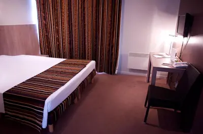 Un ou plusieurs lits dans un hébergement de l'établissement L'AUBERGE DU RHONE