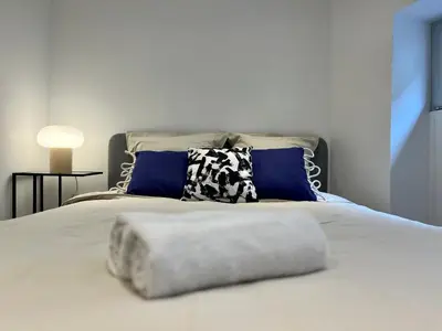 Un ou plusieurs lits dans un hébergement de l'établissement Suite Maël - Appartement 4 personnes - Check in h24 & Wifi