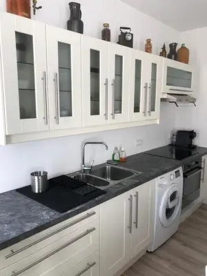 Cuisine ou kitchenette dans l'établissement Joli logement au centre de Trévoux