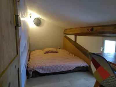 Un ou plusieurs lits dans un hébergement de l'établissement Tiny duplex climatisé
