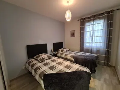 Un ou plusieurs lits dans un hébergement de l'établissement Appartement de standing au centre de Chassieu
