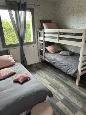 Un ou plusieurs lits dans un hébergement de l'établissement Comme à la maison…