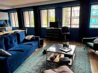 Coin salon dans l'établissement Appartement spacieux 2 chambres avec vue sur le Rhône et parc