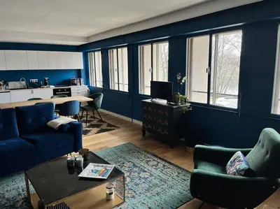 Coin salon dans l'établissement Appartement spacieux 2 chambres avec vue sur le Rhône et parc