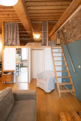 Un ou plusieurs lits dans un hébergement de l'établissement Le petit Imbert - studio chaleureux et cozy