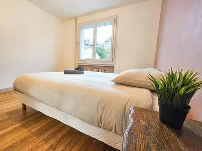 Un ou plusieurs lits dans un hébergement de l'établissement Le Bergson 3 chambres Stationnement gratuit