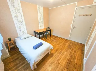 Un ou plusieurs lits dans un hébergement de l'établissement Le Bergson 3 chambres Stationnement gratuit