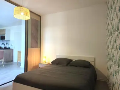 Un ou plusieurs lits dans un hébergement de l'établissement Bel Appartement Meximieux Centre Ville 2 chambres