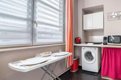 Cuisine ou kitchenette dans l'établissement Charmant studio Hyper-centre