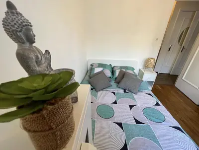 Un ou plusieurs lits dans un hébergement de l'établissement Chambre pour une personne proche de la Gare