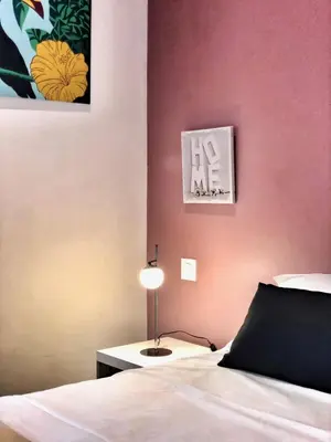 Un ou plusieurs lits dans un hébergement de l'établissement Hôtel Ô9 marches