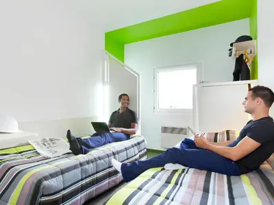 Un ou plusieurs lits dans un hébergement de l'établissement KRYSTAL HOTEL